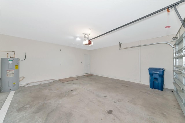 garage with electric water heater and a garage door opener