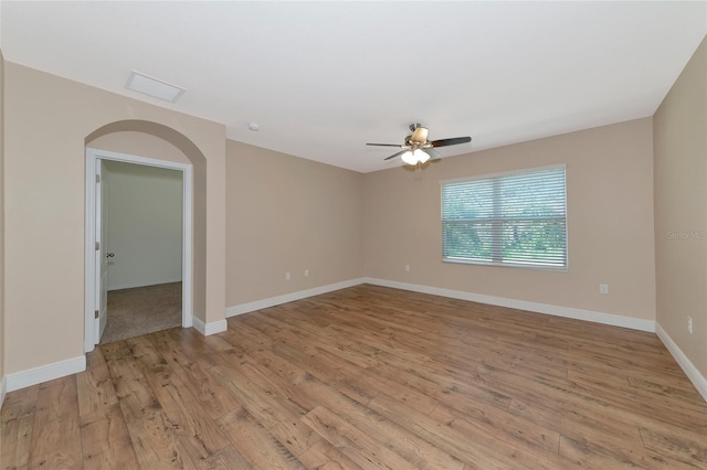 unfurnished room featuring ceiling fan and light hardwood / wood-style floors