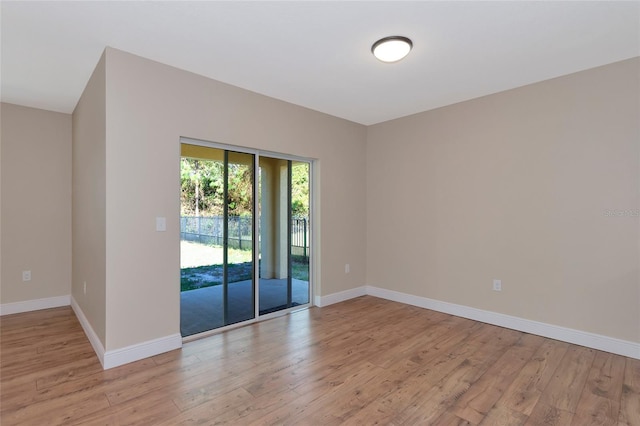 unfurnished room with light hardwood / wood-style flooring