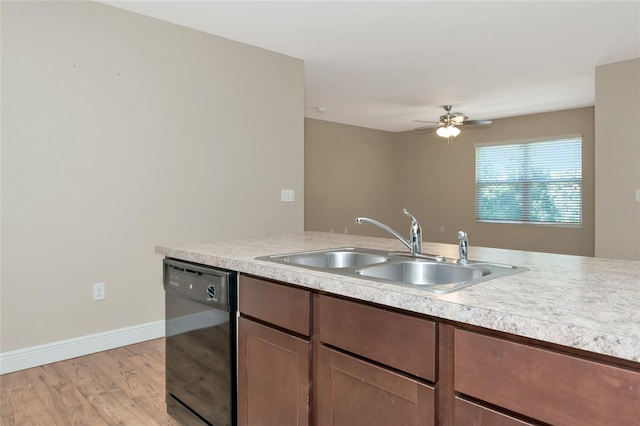 kitchen with ceiling fan, sink, black dishwasher, and light hardwood / wood-style floors