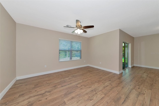 unfurnished room with ceiling fan, plenty of natural light, and light hardwood / wood-style flooring