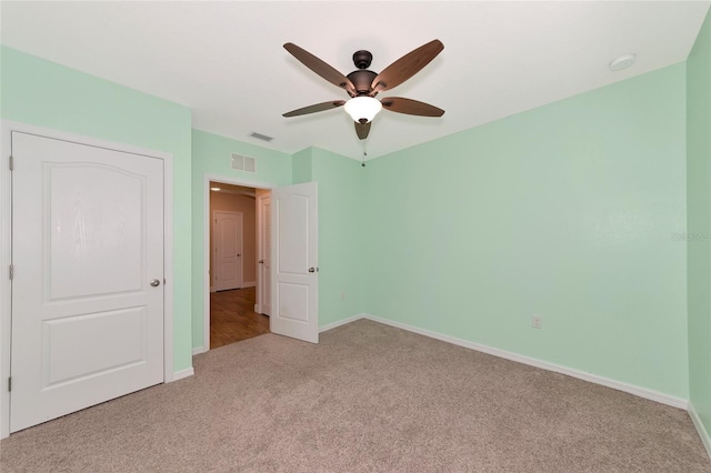 unfurnished bedroom with light carpet and ceiling fan