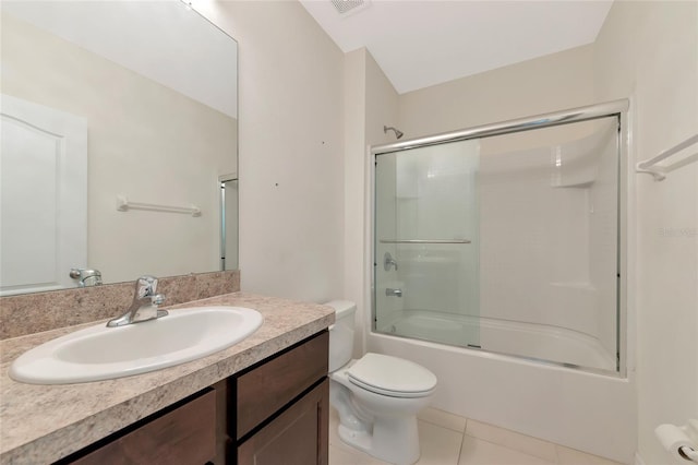 full bathroom featuring vanity, enclosed tub / shower combo, tile patterned floors, and toilet