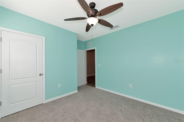 unfurnished bedroom featuring light colored carpet and ceiling fan