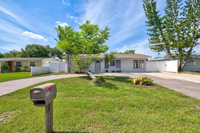 ranch-style house featuring a front lawn