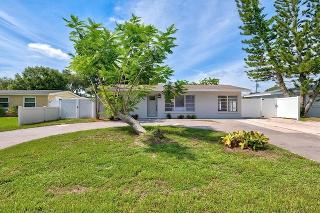 ranch-style house with a front lawn