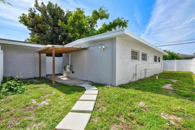 view of property exterior featuring a yard