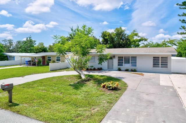 single story home with a front yard