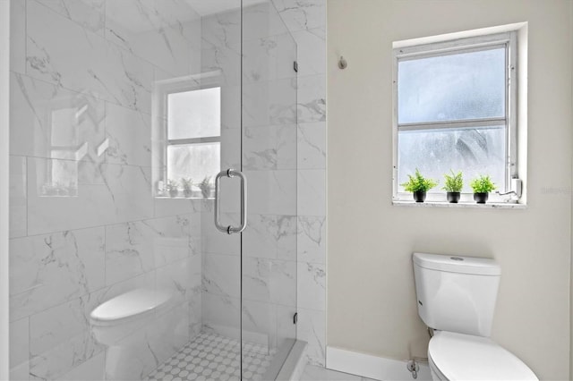 full bathroom featuring toilet, a marble finish shower, and plenty of natural light