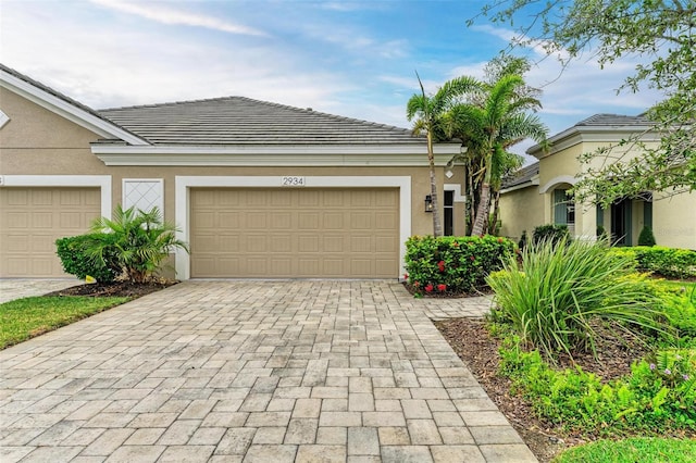 single story home with a garage