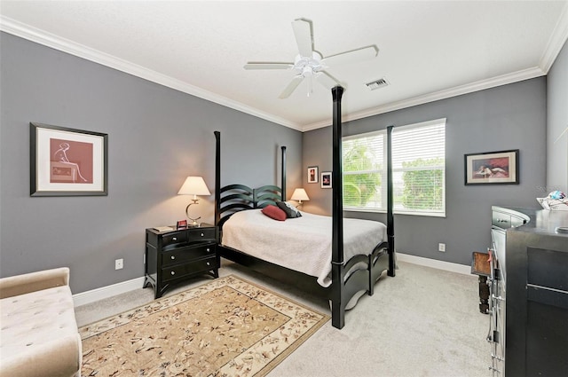 carpeted bedroom with ceiling fan and crown molding