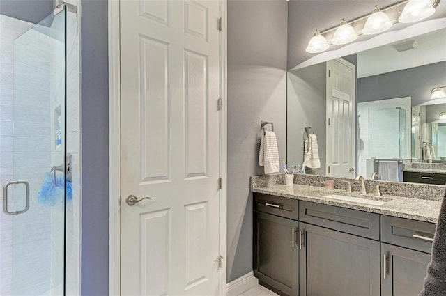 bathroom featuring vanity and walk in shower