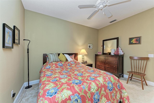 bedroom with light carpet and ceiling fan