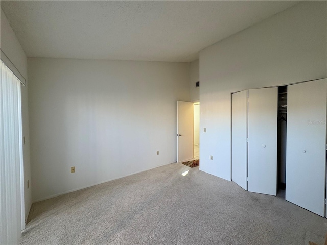 unfurnished bedroom featuring a closet and carpet flooring