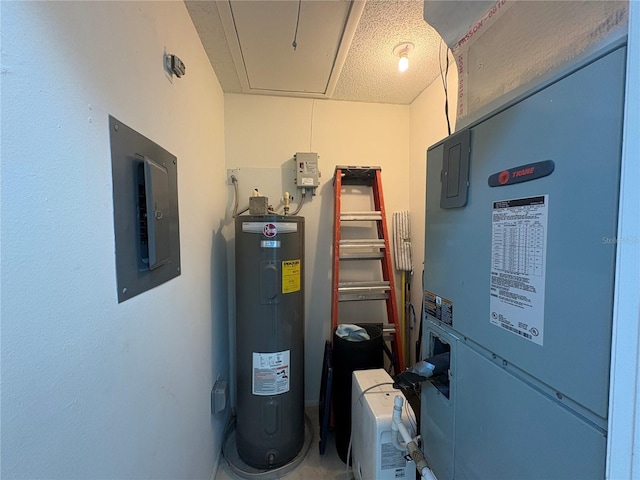 utility room featuring electric panel and water heater