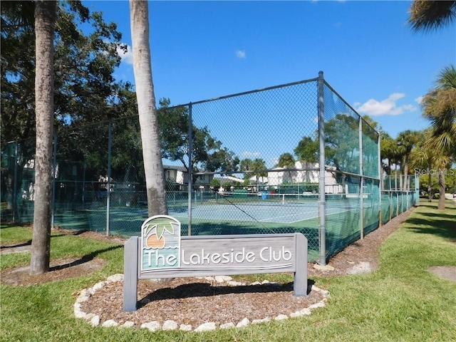 view of tennis court with fence