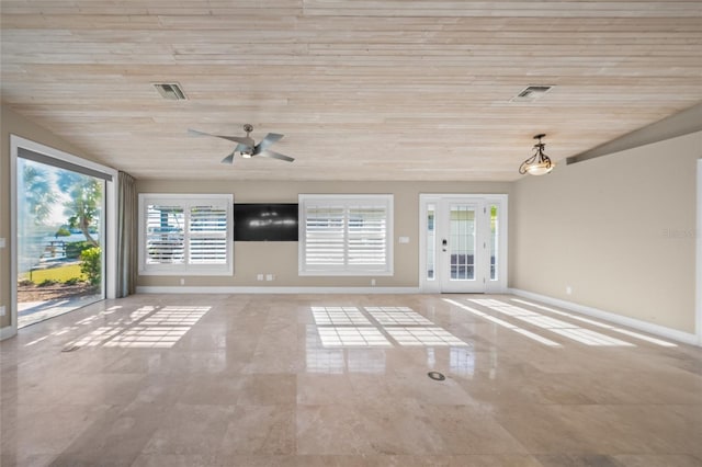 unfurnished living room featuring ceiling fan and wood ceiling