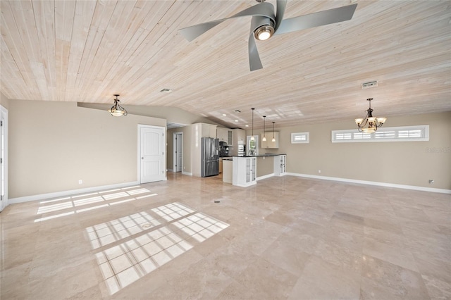 unfurnished living room with ceiling fan with notable chandelier, wooden ceiling, and vaulted ceiling