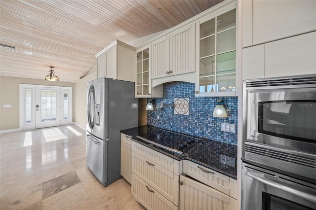 kitchen featuring decorative backsplash, wood ceiling, and stainless steel appliances