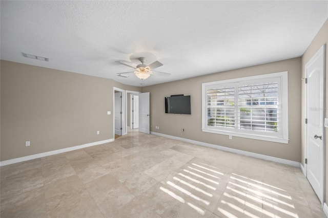 unfurnished bedroom featuring ceiling fan