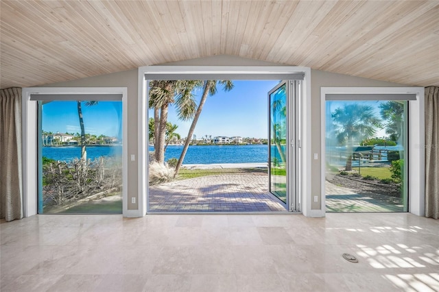 entryway with a water view, lofted ceiling, and wooden ceiling