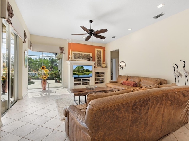 tiled living room featuring ceiling fan