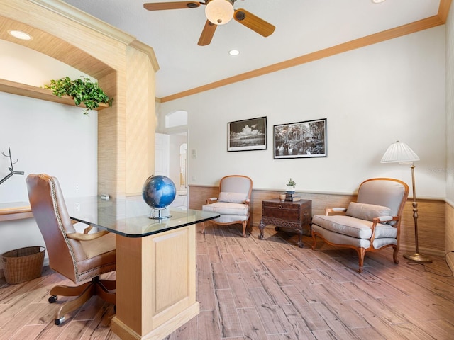 office with crown molding, wood-type flooring, and ceiling fan