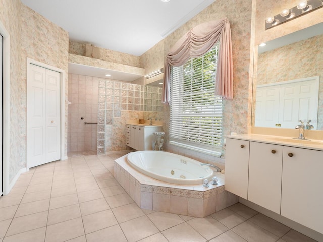 bathroom featuring vanity, crown molding, tile patterned floors, and tiled bath