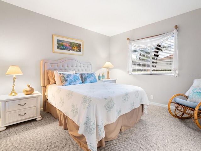 bedroom featuring light carpet