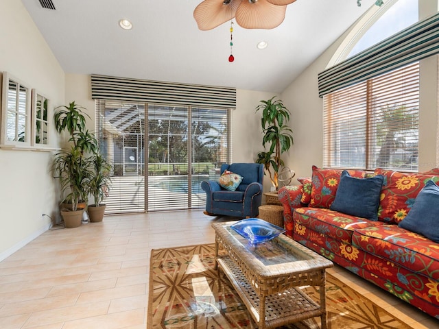 living room featuring light hardwood / wood-style floors, lofted ceiling, and ceiling fan