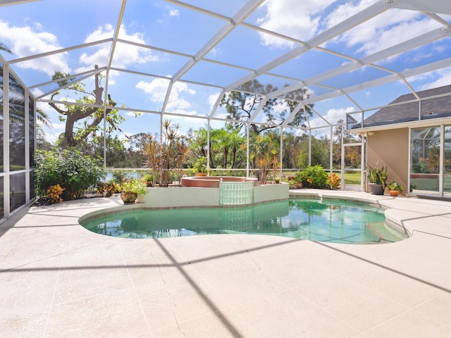 view of pool with a patio and a lanai