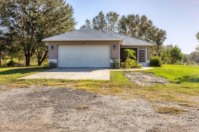 ranch-style home with a front yard and a garage