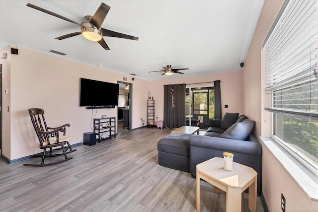 living room with hardwood / wood-style floors and ceiling fan