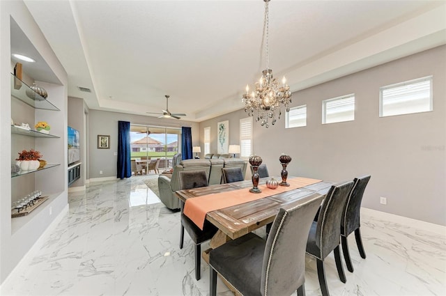 dining space featuring ceiling fan with notable chandelier