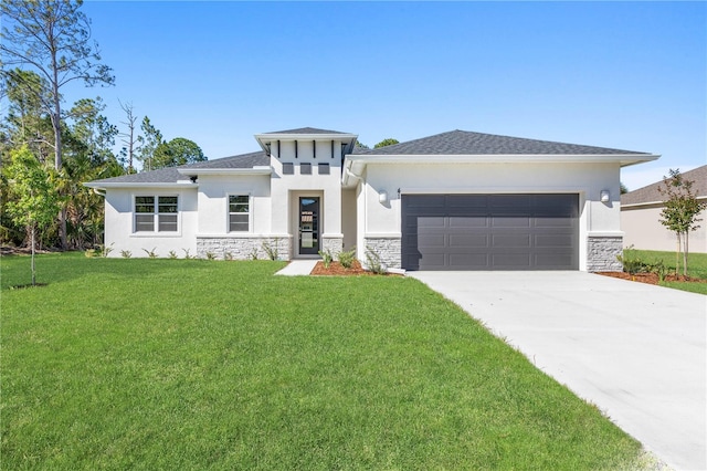 prairie-style home with an attached garage, a front lawn, stone siding, stucco siding, and driveway