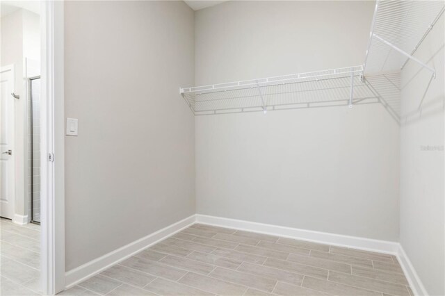 2938 Woodward Ave, North Port, FL 34286 - spacious closet featuring light wood finished floors