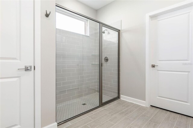 2938 Woodward Ave, North Port, FL 34286 - bathroom with baseboards and tiled shower