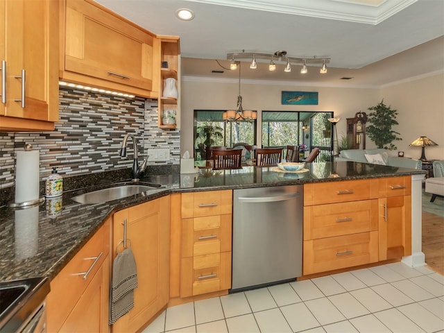 kitchen with crown molding, dark stone countertops, stainless steel appliances, and sink