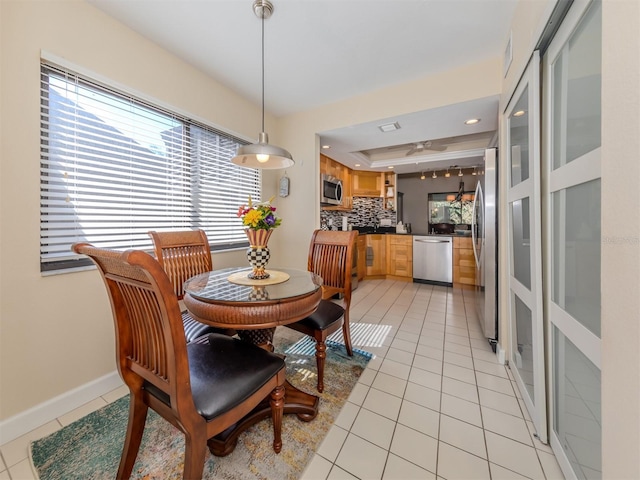 dining space with light tile patterned floors