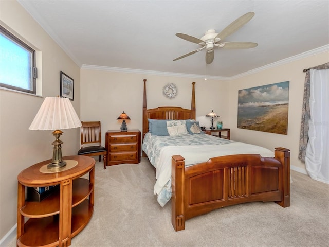 carpeted bedroom with crown molding and ceiling fan