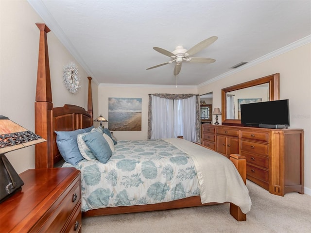 carpeted bedroom featuring ornamental molding and ceiling fan