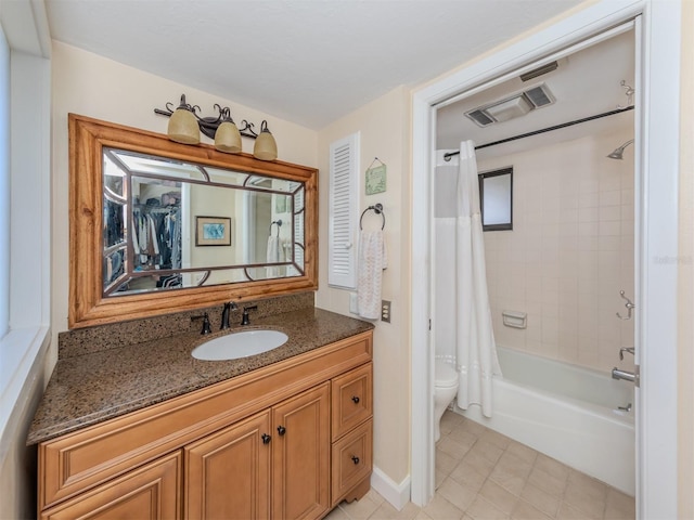 full bathroom featuring vanity, shower / tub combo with curtain, toilet, and tile patterned flooring