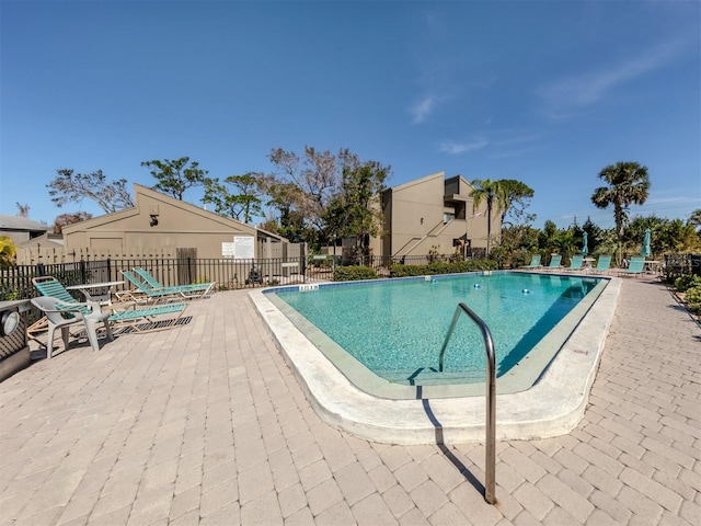 view of swimming pool with a patio area