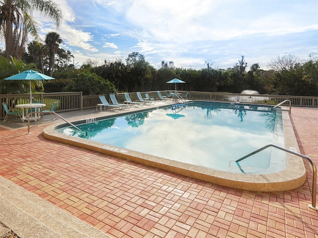 view of pool featuring a patio