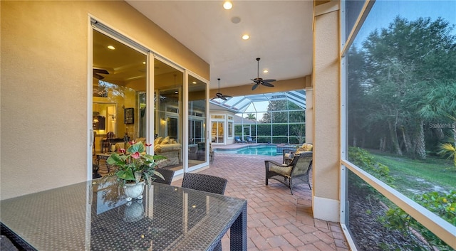 view of patio / terrace featuring a lanai