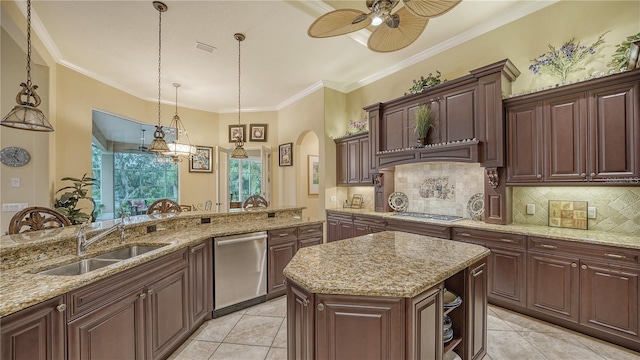 kitchen with a center island, sink, hanging light fixtures, ornamental molding, and stainless steel appliances