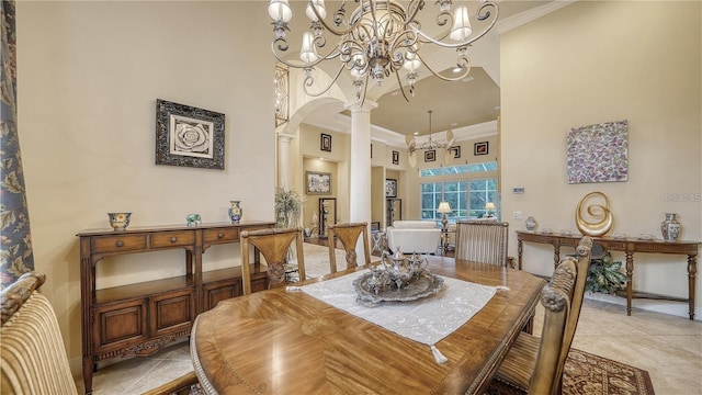 tiled dining space featuring a high ceiling, an inviting chandelier, ornate columns, and crown molding