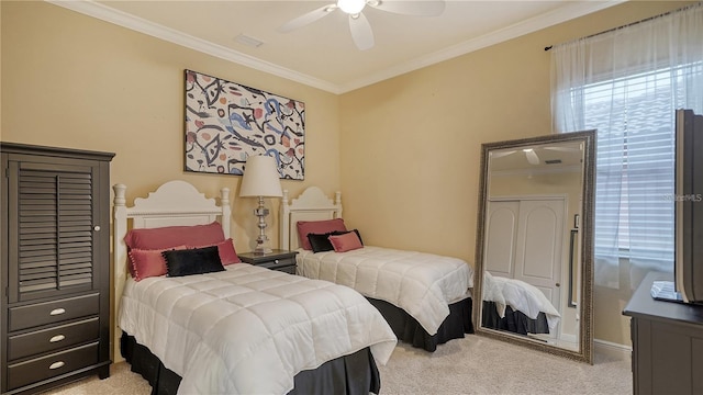 bedroom featuring light colored carpet, ceiling fan, and crown molding