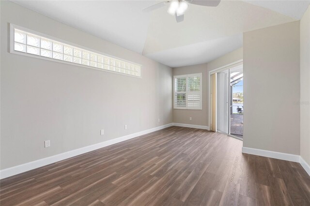 11332 Rivers Bluff Cir, Lakewood Ranch, FL 34202 - spare room featuring ceiling fan, baseboards, dark wood-style flooring, and vaulted ceiling