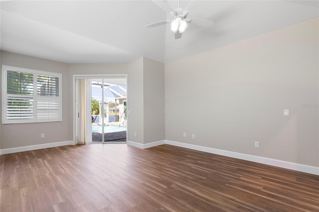 empty room with ceiling fan and dark wood-type flooring